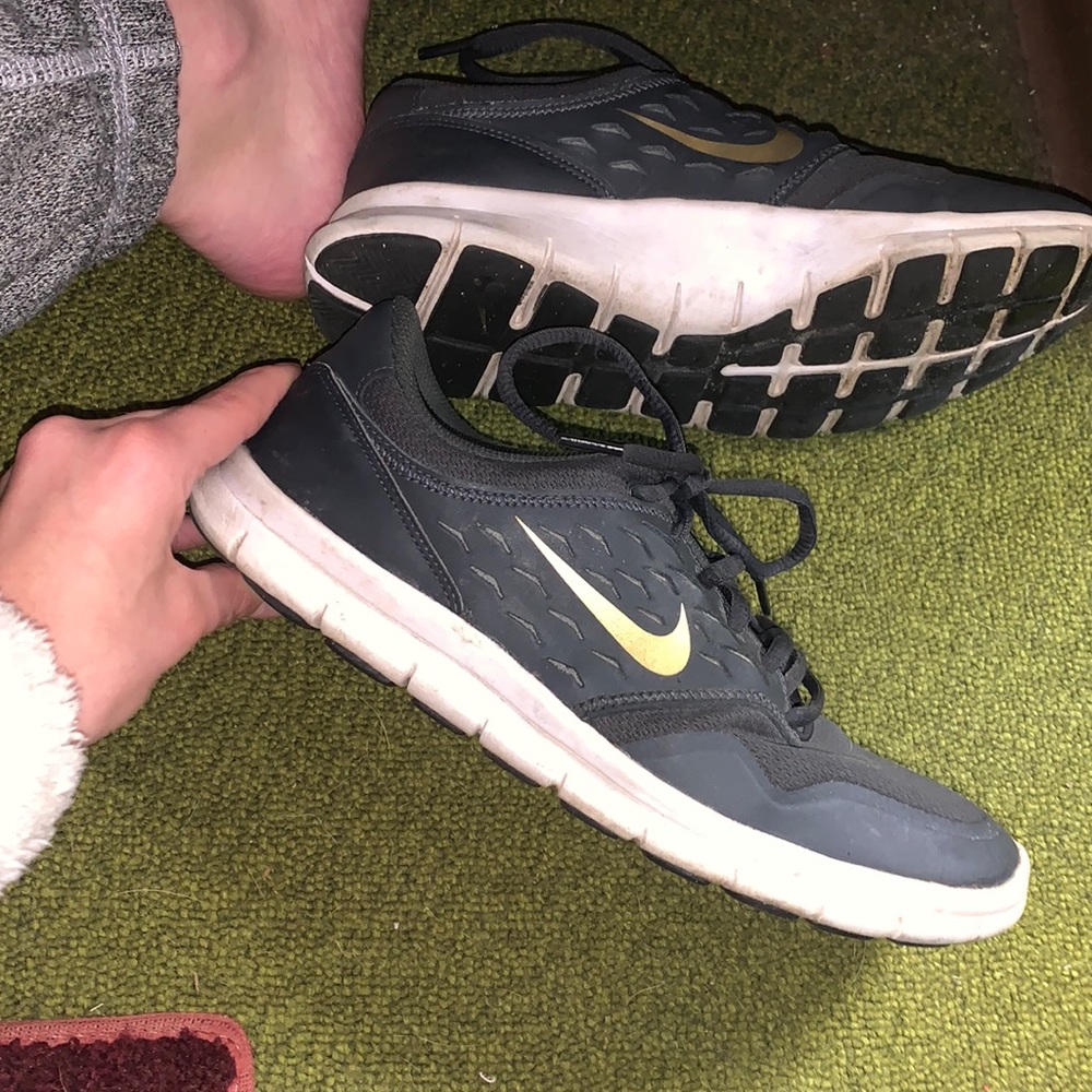 Nike women’s grey and gold running shoes